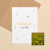 Dankjewel wenskaart met bloemenzaad met goudsbloemen