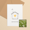 Happy New Home wenskaart met bloemenzaad met duifkruid