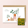 New Home wenskaart met bloemenzaad met goudsbloemen